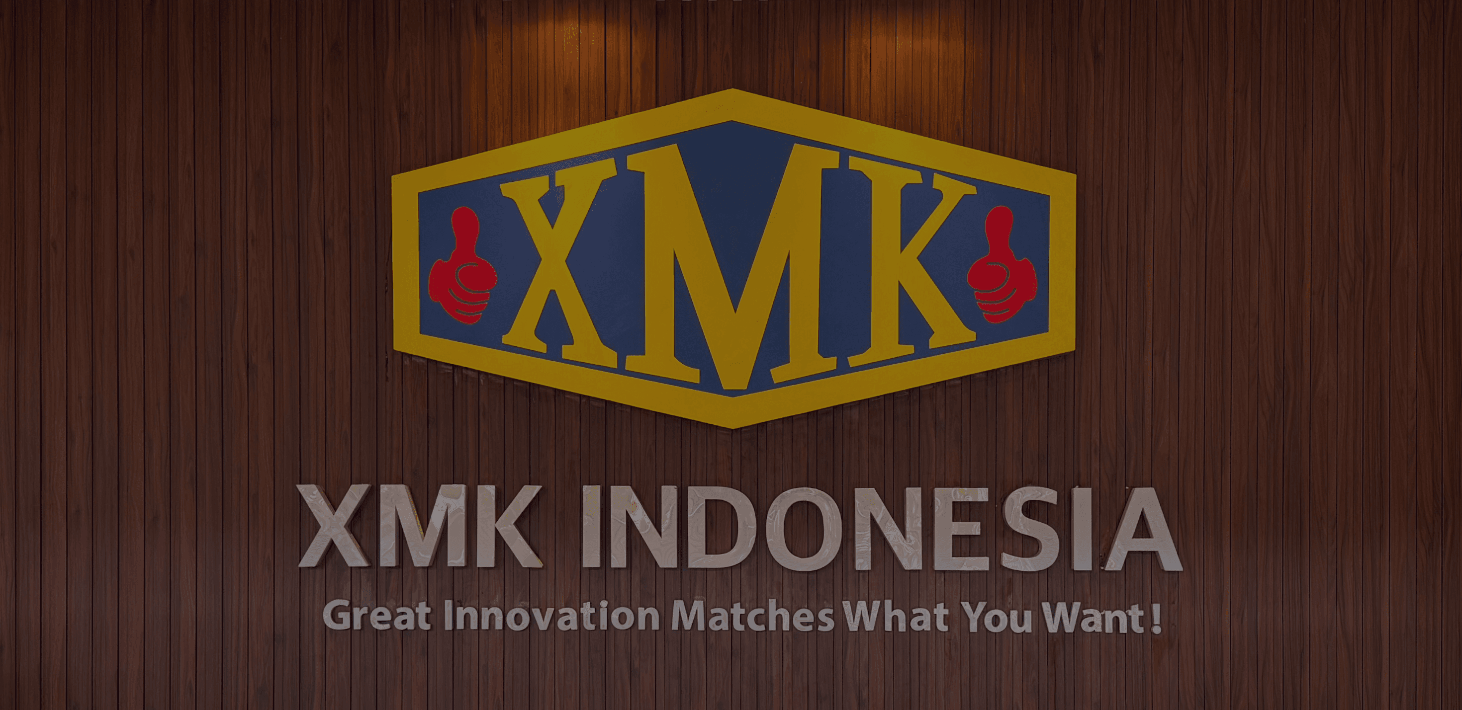 XMK Indonesia logo on a wood-paneled wall
